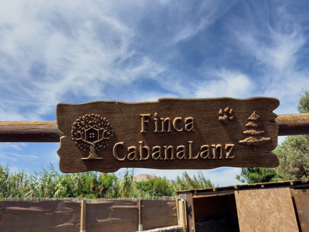 Carved wooden sign reading Finca CabanaLanz in San Bartolomé, Lanzarote